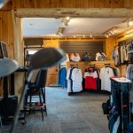 Inside of retail store with golf shirts on display