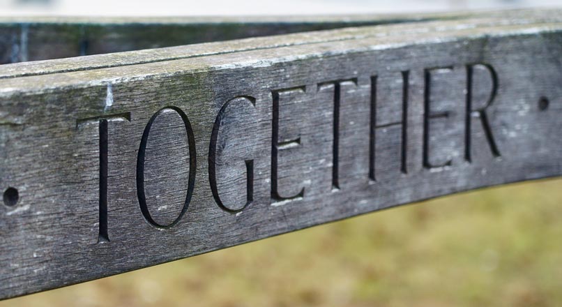 close-up shot of sign labeled "together"